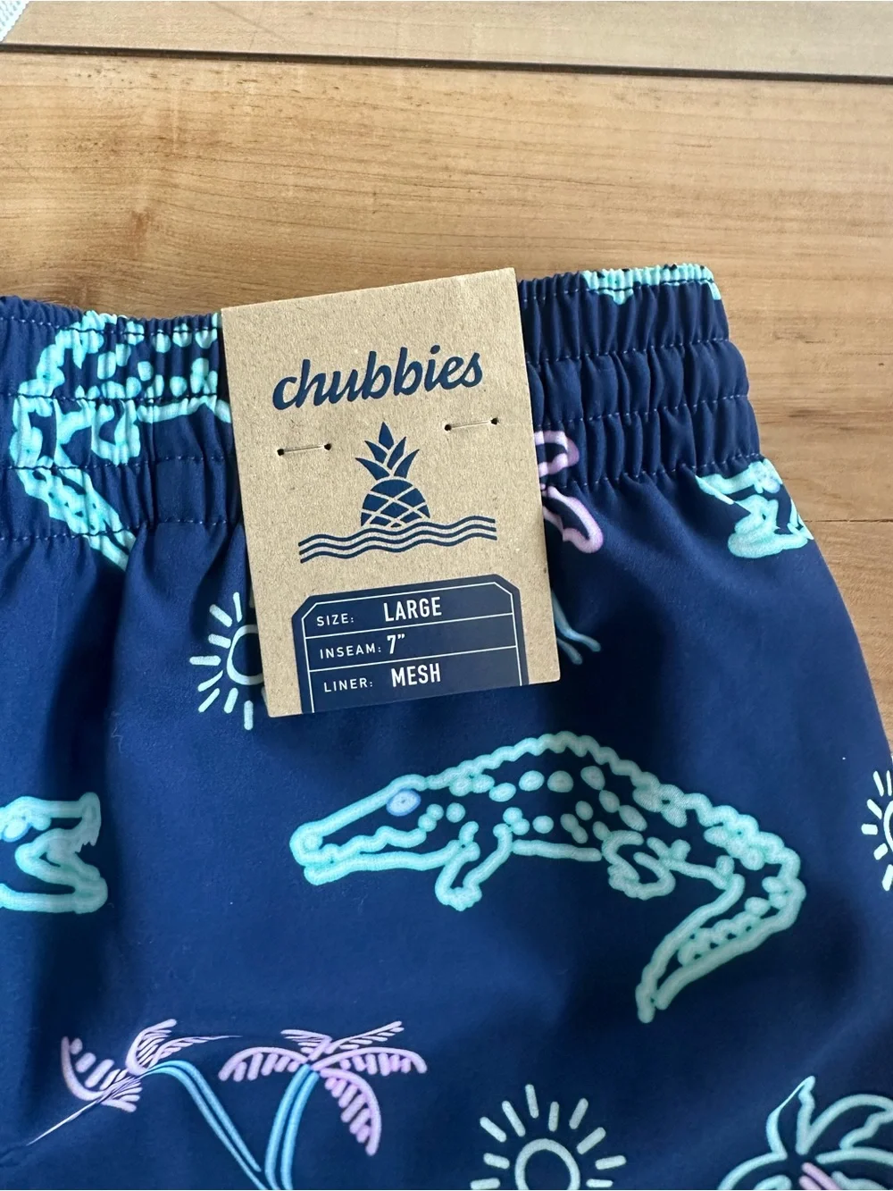 chubbies Navy Swim Trunks with Mint & Pastel Pink Alligator Print 7 inch